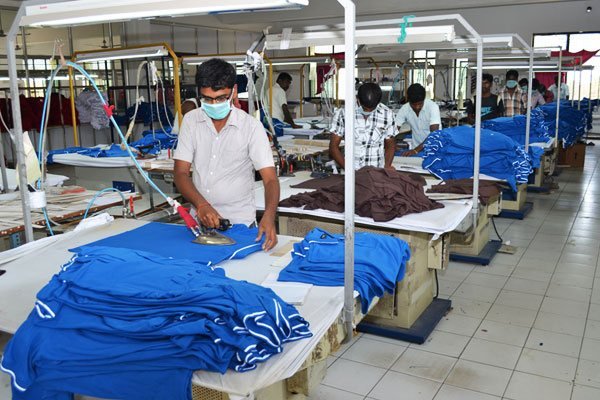 Quality inspector examining a finished garment