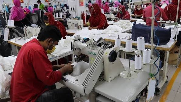 Sewing operators working on garments in a factory